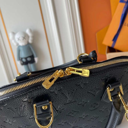Alma Gold Monogram Leather Bucket Bag